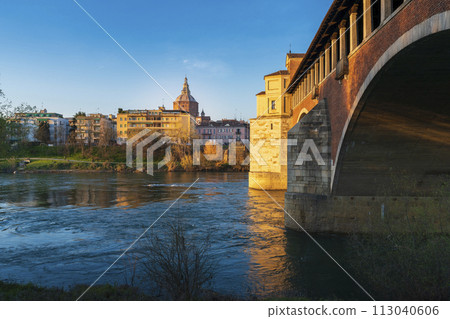 Panorama of covered bridge and Pavia cathedral at sunny day Panorama of covered bridge and Pavia cathedral at sunny day 113040606