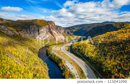 Scenic road in Canadian Mountain Landscape Valley with River. Fall Season. Corner Brook, Newfoundland, Canada Scenic road in Canadian Mountain Landscape Valley with River. Fall Season. Corner Brook, Newfoundland, Canada 113041099