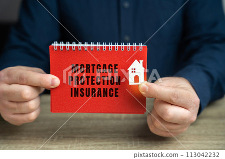 Mortgage protection insurance concept. Type of insurance policy that helps family make your monthly mortgage payments. Business and finance. Notebook and businessman Mortgage protection insurance concept. Type of insurance policy that helps family make your monthly mortgage payments. Business and finance. Notebook and businessman 113042232