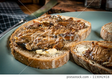 Slices of multigrain bread with sprats. Slices of multigrain bread with sprats. 113042418