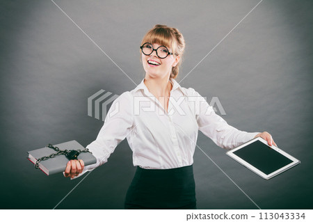 Woman with document and tablet. Digital storage. Woman with document and tablet. Digital storage. 113043334