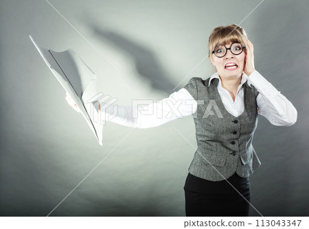 Fly fear. Woman holding airplane in hand. 113043347