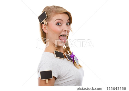 Teenage girl having little blackboards in hair Teenage girl having little blackboards in hair 113043366