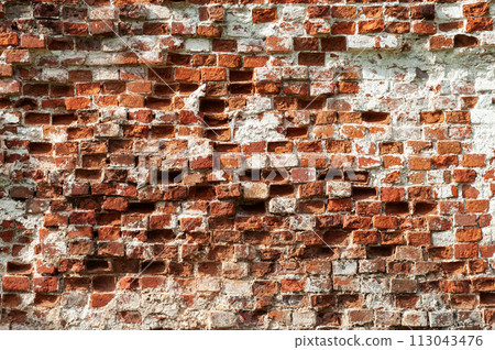 Old destroyed red brick wall 113043476
