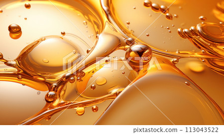 Oil drops on water. Oil spheres floating in a golden liquid. Bubbles of different sizes on orange abstract background 113043522