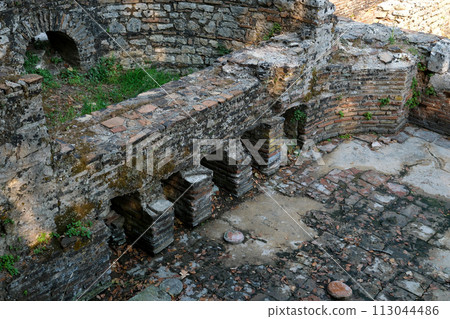Ruins of Great Basilica in Butrint National Park, Buthrotum, Albania. Triconch Palace at Butrint Life and death of an ancient Roman house Historical medieval Venetian Tower surrounded. High quality 113044486