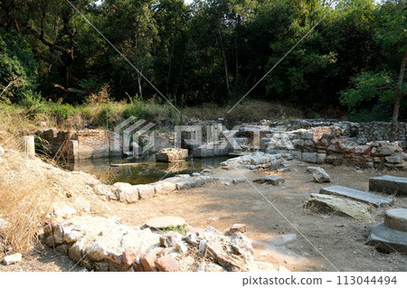 Ruins of Great Basilica in Butrint National Park, Buthrotum, Albania. Triconch Palace at Butrint Life and death of an ancient Roman house Historical medieval Venetian Tower surrounded. High quality 113044494