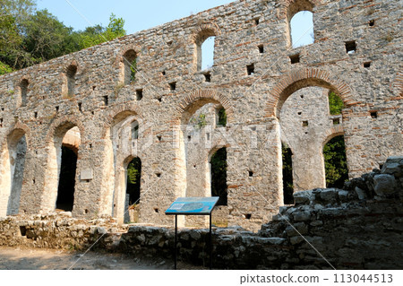 Ruins of Great Basilica in Butrint National Park, Buthrotum, Albania. Triconch Palace at Butrint Life and death of an ancient Roman house Historical medieval Venetian Tower surrounded. High quality 113044513