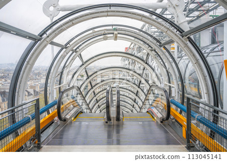 An enclosed escalator passes through a transparent tunnel providing a futuristic perspective inside the Centre Pompidou. Paris, France An enclosed escalator passes through a transparent tunnel providing a futuristic perspective inside the Centre Pompidou. Paris, France 113045141