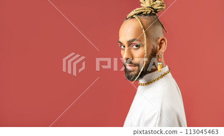 Black latin gay man isolated on pink background 113045463