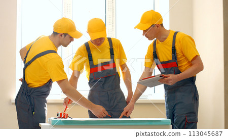 Foremen create a new project. Construction crew is exploring the scheme of the building. 113045687