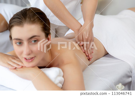 Caucasian couple customer enjoying relaxing anti-stress massage. Quiescent 113046741