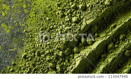 Close up of green matcha powder texture scattered on surface 113047946