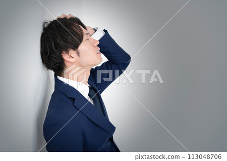 Businessman suffers 113048706