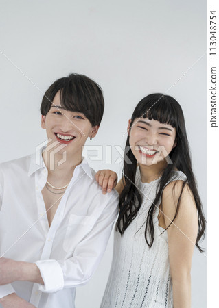 Genderless makeup image: Young men and women smiling looking at the camera 113048754