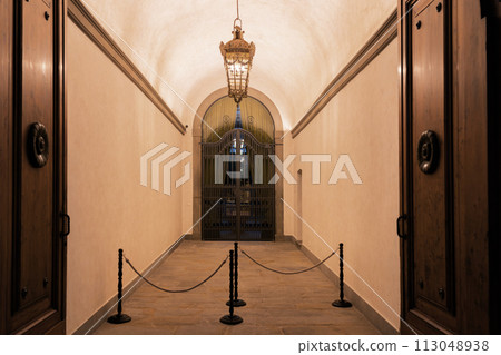 Beautiful ornate wooden door at the entrance to small courtyard in Italian town, Northern Italy Beautiful ornate wooden door at the entrance to small courtyard in Italian town, Northern Italy 113048938