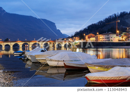 Pier and boats docked at marina on Lake Como in the harbor of the city of Lecco Pier and boats docked at marina on Lake Como in the harbor of the city of Lecco 113048943