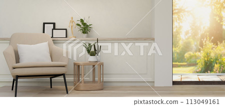 The interior design of a contemporary living room features a modern armchair and a coffee table. 113049161