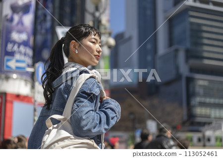 A young lady walking in the city A young lady walking in the city 113052461