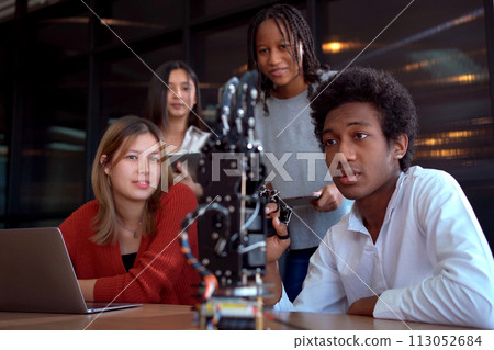 Group of international or multi ethnicity student having a discussion together about science project in class room. Group of international or multi ethnicity student having a discussion together about science project in class room. 113052684