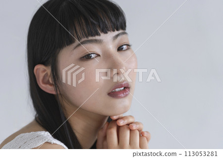 Young woman looking at camera beauty image portrait 113053281