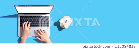 Laptop computer with piggy bank Laptop computer with piggy bank 113054832