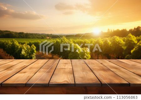 empty table with blurred vineyard on sunset as background 113056863