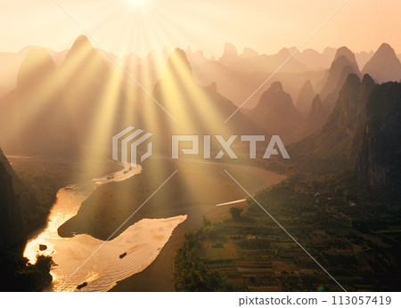 Sunbeams shining through the beautiful rock formations of Guilin Sunbeams shining through the beautiful rock formations of Guilin 113057419