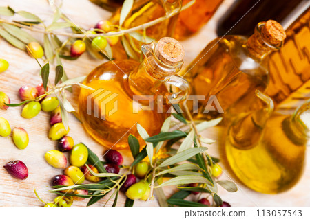 Decanters and bottles with olive oil Decanters and bottles with olive oil 113057543