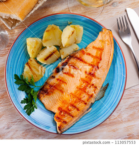 Grilled trout fillet with potatoes Grilled trout fillet with potatoes 113057553