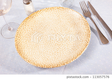 Plate with silverware, nothing served 113057576