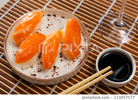 Sushi set of nigiri, served on rectangular plate 113057577