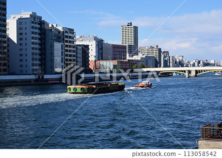 Sumida River, towboat, and urban scenery from near Ryogoku Sumida River, towboat, and urban scenery from near Ryogoku 113058542