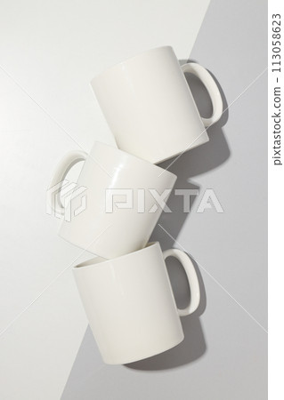 White glass cups on a light background 113058623