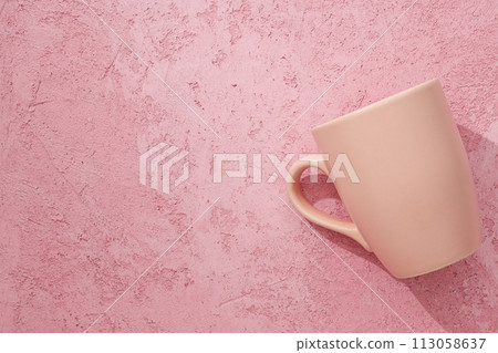 A beautiful cup on a pink background 113058637