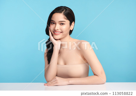 Beautiful Young transgender woman with clean fresh skin on blue background, Face care, Facial treatment, Cosmetology, beauty and spa, transgender women portrait. Beautiful Young transgender woman with clean fresh skin on blue background, Face care, Facial treatment, Cosmetology, beauty and spa, transgender women portrait. 113058822