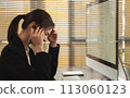 Stressed businesswoman have headaches due to working on a computer screen for a long time. May be office syndrome. 113060123