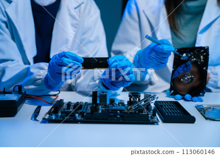 Close up of Technician measuring voltage electronic circuit board, Service after sale fix electric equipment. Close up of Technician measuring voltage electronic circuit board, Service after sale fix electric equipment. 113060146