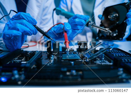 Close up of Technician measuring voltage electronic circuit board, Service after sale fix electric equipment. Close up of Technician measuring voltage electronic circuit board, Service after sale fix electric equipment. 113060147