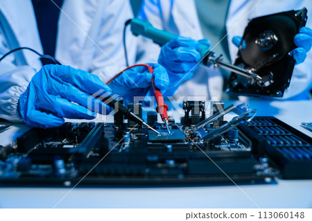 Close up of Technician measuring voltage electronic circuit board, Service after sale fix electric equipment. Close up of Technician measuring voltage electronic circuit board, Service after sale fix electric equipment. 113060148