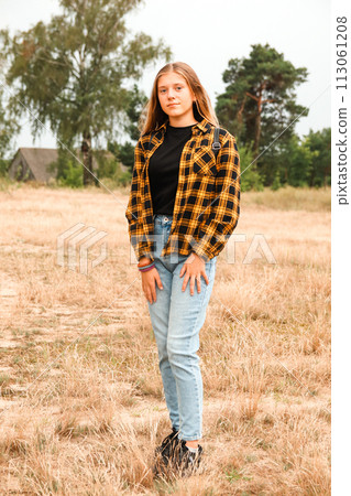 Assured girl outside. Portrait preteen girl on the nature backgr 113061208