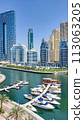 Panoramic view of Dubai Marina, Dubai Marina is an artificial channel with a length of 3 km, laid along the coastline of the Persian Gulf 113063205