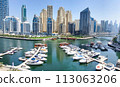Dubai Marina skyscrapers. Dubai Marina is an artificial channel with a length of 3 km, laid along the coastline of the Persian Gulf 113063206