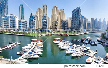 Dubai Marina skyscrapers. Dubai Marina is an artificial channel with a length of 3 km, laid along the coastline of the Persian Gulf 113063206