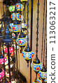 Mosaic of colored glass. Illuminated in the evening, it creates a cozy atmosphere. Vintage multicolored lamps in traditional Oriental style, Arab-style lanterns 113063217