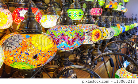 Multicolored pendant lights in oriental style. Beautiful mosaic of colored glass. Turkish multicolored lamps 113063218