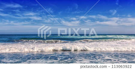 Big breaking Ocean wave on a black sandy beach on Pacific ocean Big breaking Ocean wave on a black sandy beach on Pacific ocean 113063922