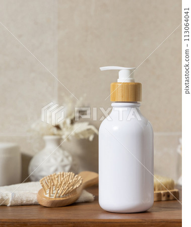 Cosmetic bottle near personal care products on wooden countertop in bathroom, mockup Cosmetic bottle near personal care products on wooden countertop in bathroom, mockup 113064041