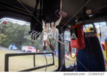 Transfusion bag with blood on board helicopter of air ambulance Transfusion bag with blood on board helicopter of air ambulance 113064187