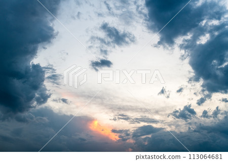 Sunset Sky with Clouds Parting for a Glimpse of Orange Light Sunset Sky with Clouds Parting for a Glimpse of Orange Light 113064681
